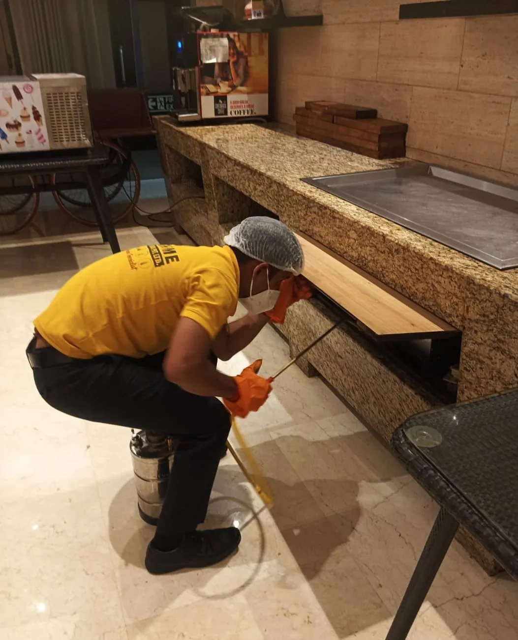 Safe Home technician treating furniture in a hotel lobby