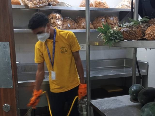 Treating storage racks in a chilled food store